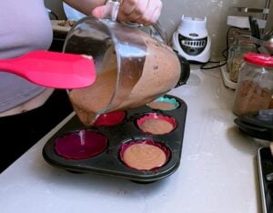 Place the cupcake molds in a tray