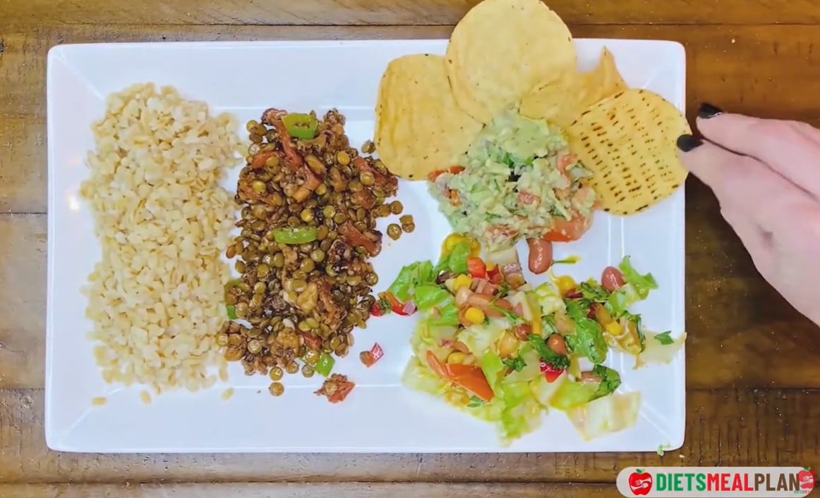 Vegan Mexican Burrito Recipe - Add boiled brown rice to one side and tortilla chips to the other. Serve immediately