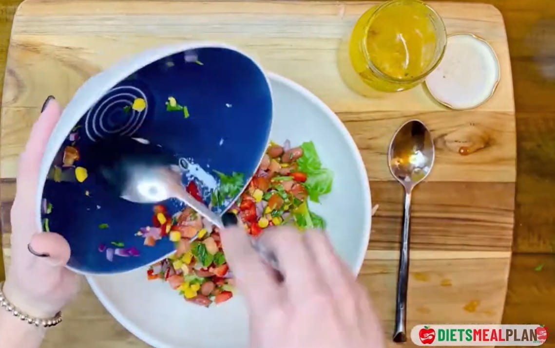 Vegan Mexican Burrito Recipe - Layer the dressed lettuce on top of the bean and corn mixture